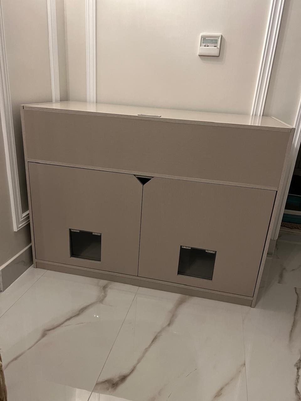 Taupe cabinet for two cats, with a cat-sized opening in each door